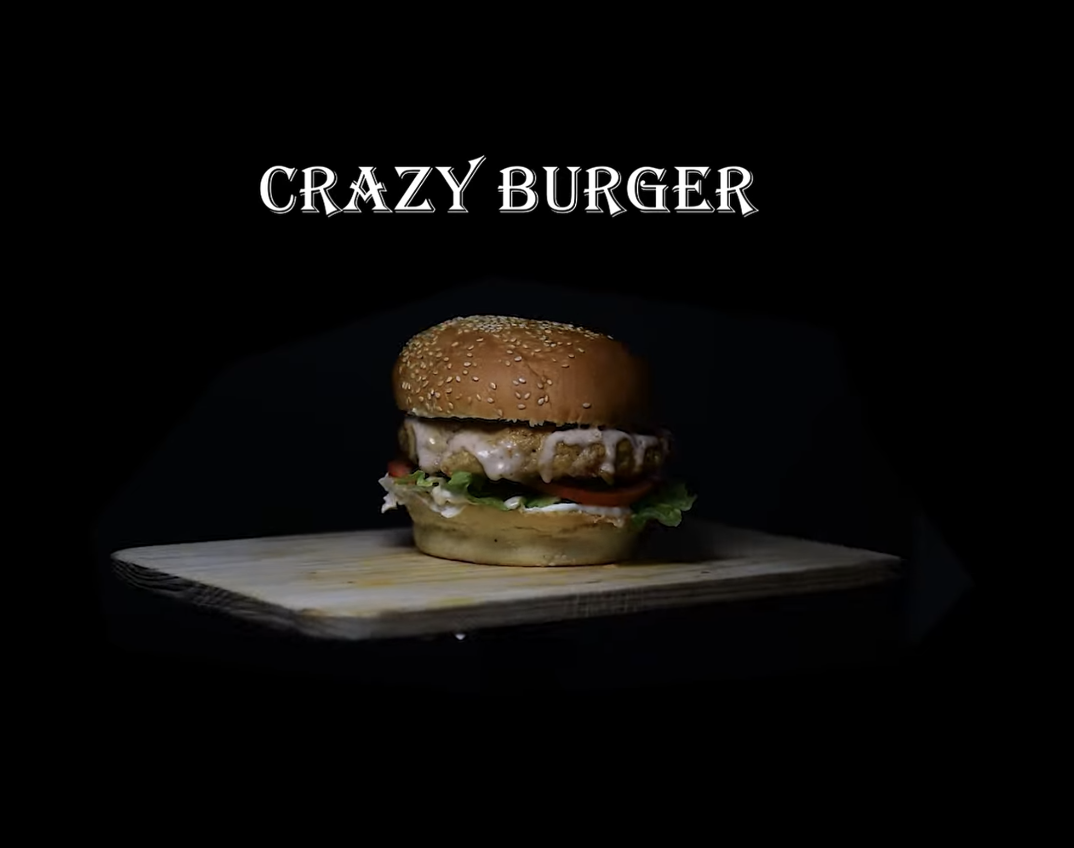 Burger on a wooden board beneath the words Crazy Burger.
